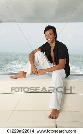 Man on yacht, smiling at camera View Large Photo Image Picture - Man on yacht, smiling at camera. Fotosearch
