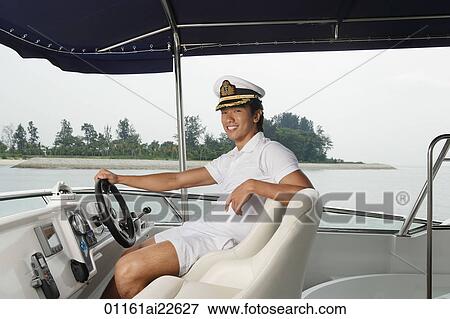 Man on yacht, smiling at camera View Large Photo Image Stock Photo - Man on yacht, smiling at camera. Fotosearch