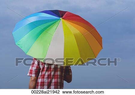 Man under rainbow umbrella, back to camera View Large Photo Image Stock Image - Man under rainbow umbrella, back to camera. Fotosearch