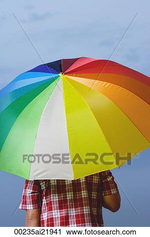 Man under rainbow umbrella, back to camera View Large Photo Image Stock Image - Man under rainbow umbrella, back to camera. Fotosearch