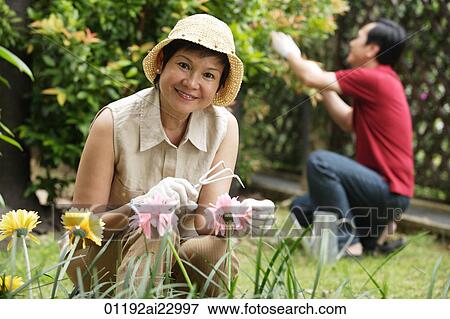 Stock Photo - Mature couple gardening. Fotosearch