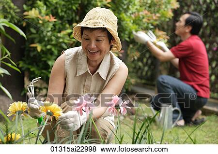 Stock Photo - Mature couple gardening. Fotosearch