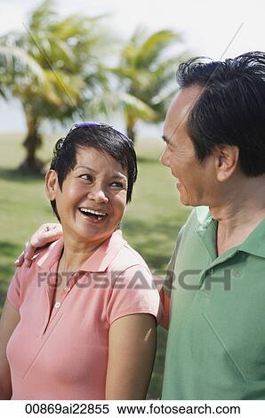 Mature couple in the park smiling at each other View Large Photo Image Stock Photography - Mature couple in the park smiling at each other. Fotosearch