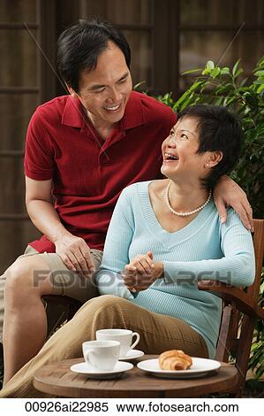 Mature couple laughing and looking at each other View Large Photo Image Stock Photography - Mature couple laughing and looking at each other. Fotosearch