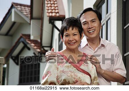 Mature couple smiling at camera View Large Photo Image Stock Photography - Mature couple smiling at camera. Fotosearch