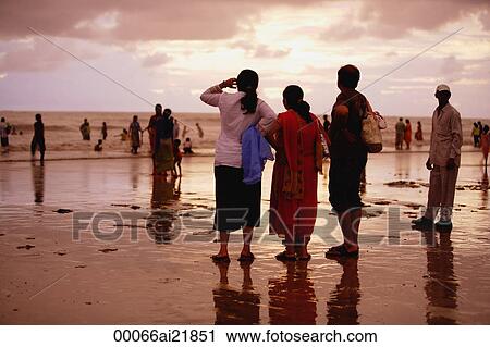 People on the beach at sunset, Mumbai, India View Large Photo Image Stock Image - People on the beach at sunset, Mumbai, India. Fotosearch