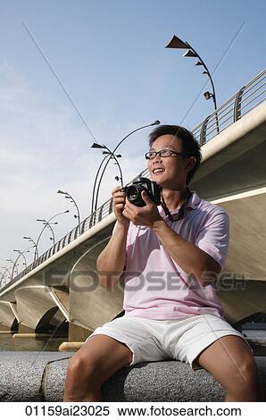 Stock Photography - Tourist taking a photograph. Fotosearch