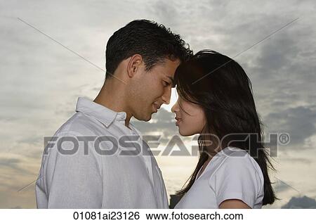 Stock Photograph - Woman taking picture of man. Fotosearch