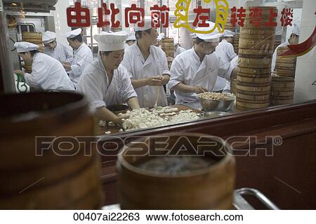 Stock Image - Workers making bun, Shanghai, China. Fotosearch