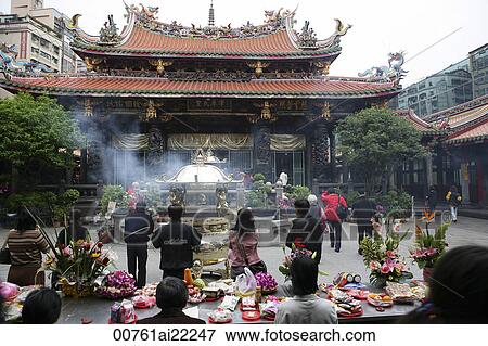 Stock Photo - Worshipper at Lungshan Temple, Taipei, Taiwan. Fotosearch