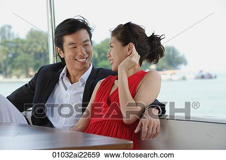 Young couple on yacht, looking at each other View Large Photo Image Stock Photo - Young couple on yacht, looking at each other. Fotosearch