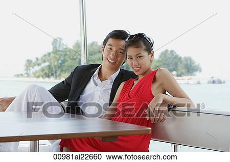 Young couple on yacht, smiling at camera View Large Photo Image Stock Image - Young couple on yacht, smiling at camera. Fotosearch