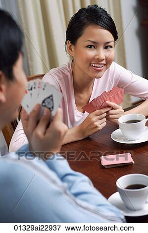 Young couple playing cards View Large Photo Image Stock Photo - Young couple playing cards. Fotosearch