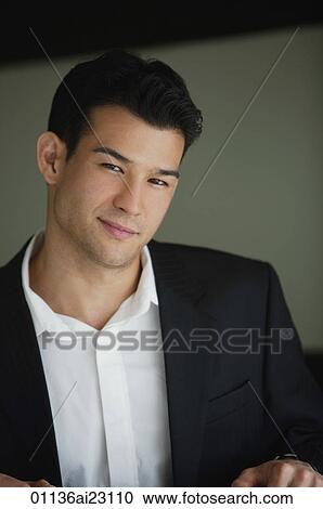 Young man smiling at camera View Large Photo Image Stock Image - Young man smiling at camera. Fotosearch