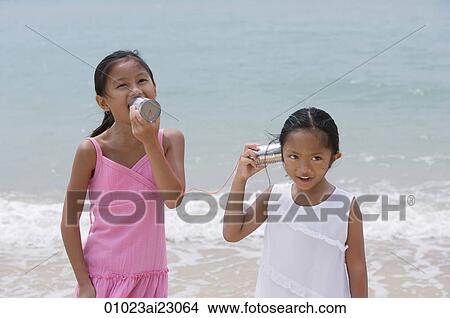 Young sisters playing with toy phones View Large Photo Image Picture - Young sisters playing with toy phones. Fotosearch