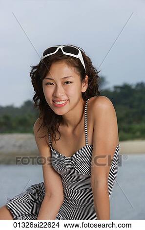 Young woman on yacht, looking at camera View Large Photo Image Picture - Young woman on yacht, looking at camera. Fotosearch