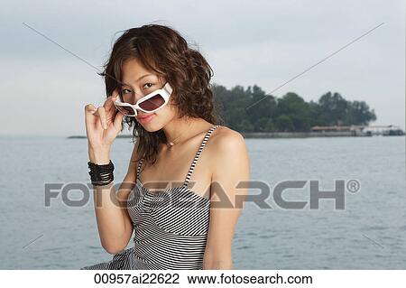 Young woman on yacht, looking at camera View Large Photo Image Stock Image - Young woman on yacht, looking at camera. Fotosearch