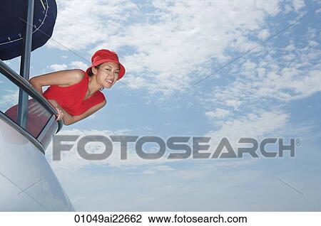 Young woman on yacht, looking at camera View Large Photo Image Stock Image - Young woman on yacht, looking at camera. Fotosearch