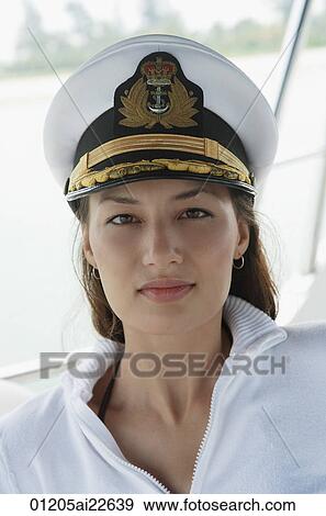 Stock Photo - Young woman on yacht, looking at camera. Fotosearch
