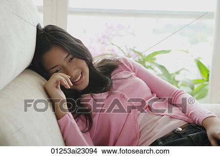Picture - Young woman smiling at camera. Fotosearch