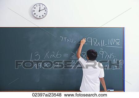 boy at chalkboard (back view) View Large Photo Image Stock Photo - boy at chalkboard (back view). Fotosearch