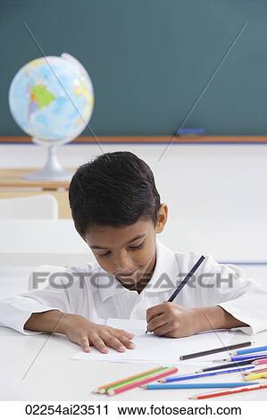 boy at desk with colored pencils View Large Photo Image Stock Image - boy at desk with colored pencils. Fotosearch
