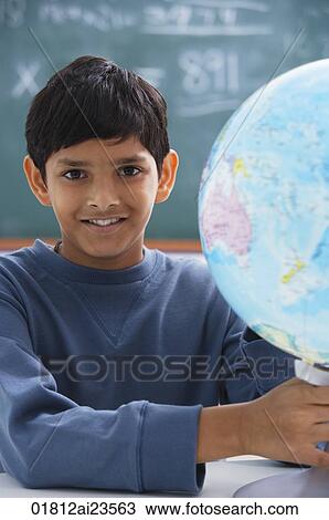 boy holding globe, gray sweatshirt View Large Photo Image Stock Image - boy holding globe, gray sweatshirt. Fotosearch