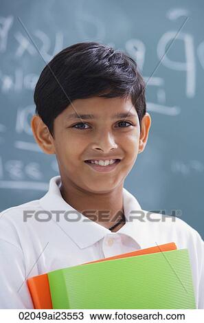 boy holding notebooks View Large Photo Image Stock Image - boy holding notebooks. Fotosearch