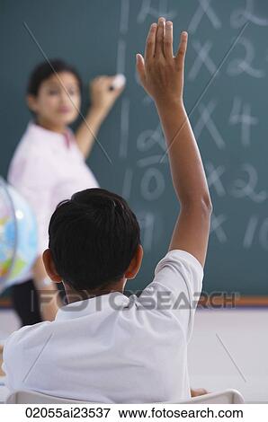 boy raises hand (back view) View Large Photo Image Stock Photo - boy raises hand (back view). Fotosearch