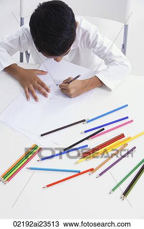 boy works with colored pencils (top view) View Large Photo Image Stock Image - boy works with colored pencils (top view). Fotosearch