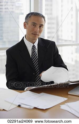 businessman, flipping through notebook View Large Photo Image Stock Photo - businessman, flipping through notebook. Fotosearch