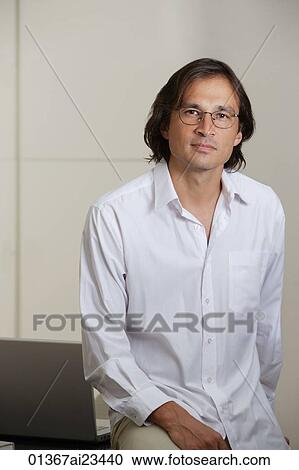 Businessman looking at camera View Large Photo Image Stock Image - Businessman looking at camera. Fotosearch