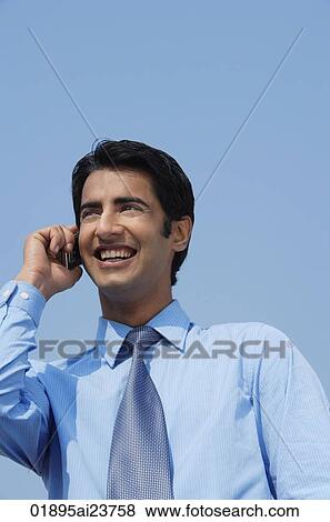 businessman on phone smiling View Large Photo Image Stock Photo - businessman on phone smiling. Fotosearch
