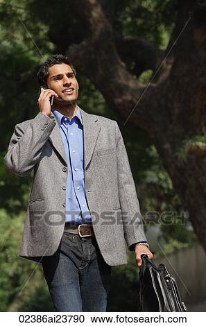businessman smiles, looks back View Large Photo Image Stock Image - businessman smiles, looks back. Fotosearch