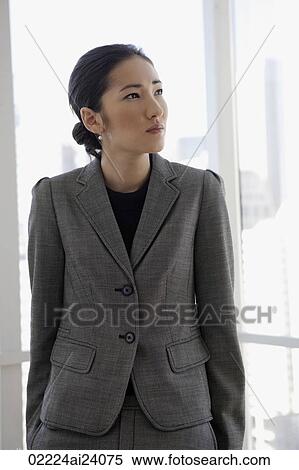 businesswoman in front of window View Large Photo Image Stock Photography - businesswoman in front of window. Fotosearch