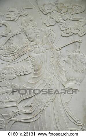 Stock Image - Chinese stone craving of an ancient fairy. Fotosearch