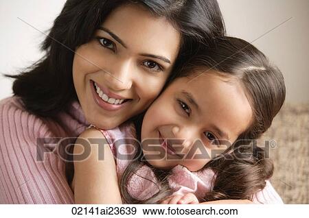 close up of mother and daughter hugging and smiling at camera View Large Photo Image Stock Photo - close up of mother and daughter hugging and smiling at camera. Fotosearch