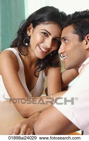Stock Photo - couple at table. Fotosearch