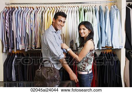 couple shopping for men's clothing View Large Photo Image Picture - couple shopping for men's clothing. Fotosearch
