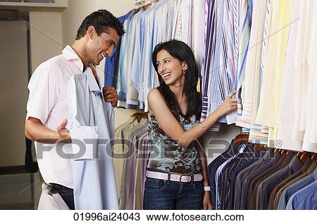 couple shopping for men's clothing View Large Photo Image Stock Image - couple shopping for men's clothing. Fotosearch