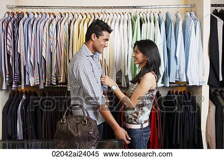 couple shopping for men's clothing View Large Photo Image Stock Photography - couple shopping for men's clothing. Fotosearch