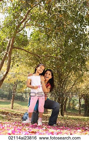 Daughter and mother in park View Large Photo Image Stock Photograph - Daughter and mother in park. Fotosearch