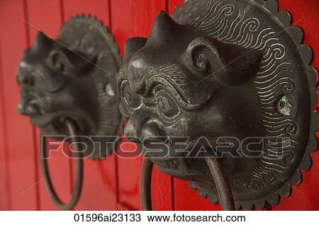 Stock Image - Decorative chinese door knockers. Fotosearch