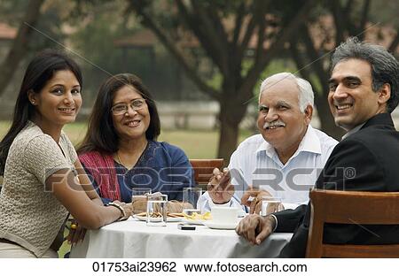 family having meal outdoors View Large Photo Image Stock Image - family having meal outdoors. Fotosearch