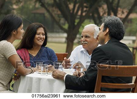 family having meal outdoors View Large Photo Image Stock Image - family having meal outdoors. Fotosearch