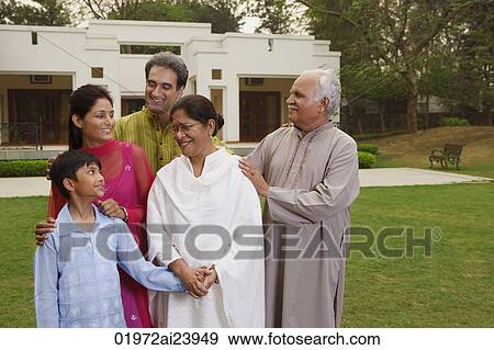 Stock Photo - family in front of home. Fotosearch