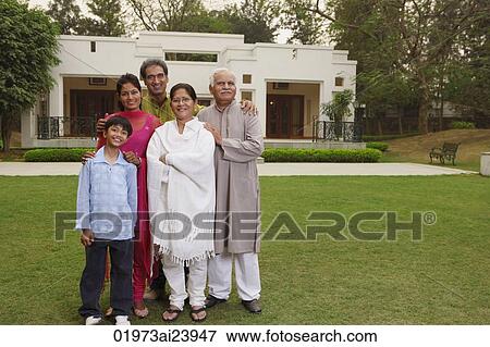 Stock Photo - family in front of home. Fotosearch