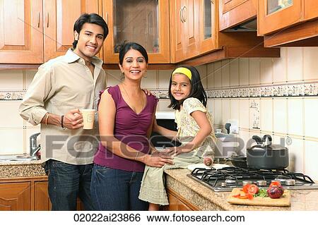 Stock Photograph - Family in kitchen. Fotosearch