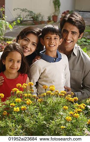 family of four with flowers View Large Photo Image Picture - family of four with flowers. Fotosearch