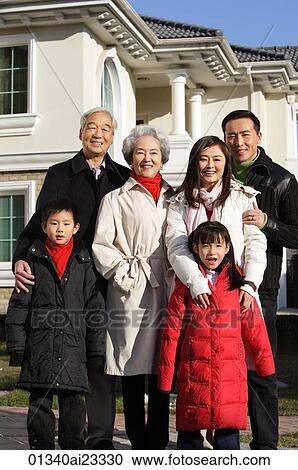 Family smiling at camera View Large Photo Image Stock Image - Family smiling at camera. Fotosearch